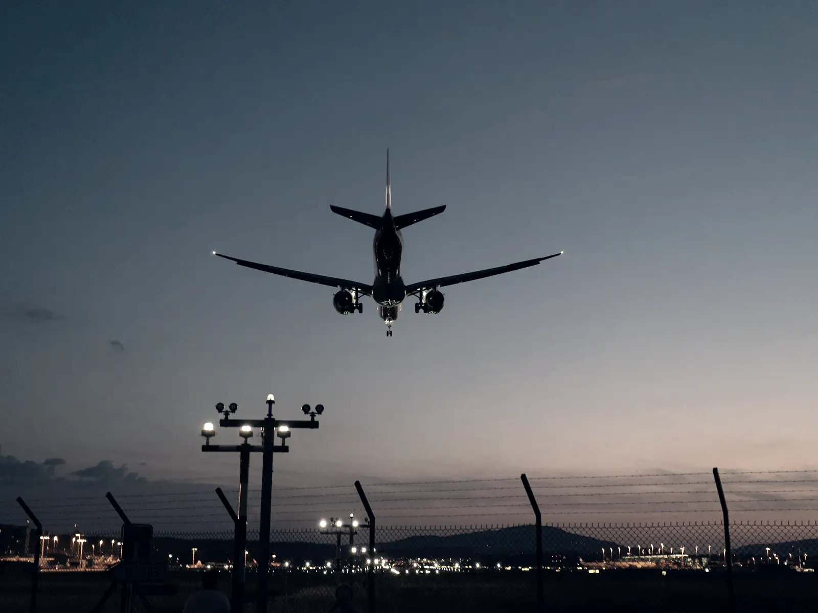 Aircraft on final approach at dusk